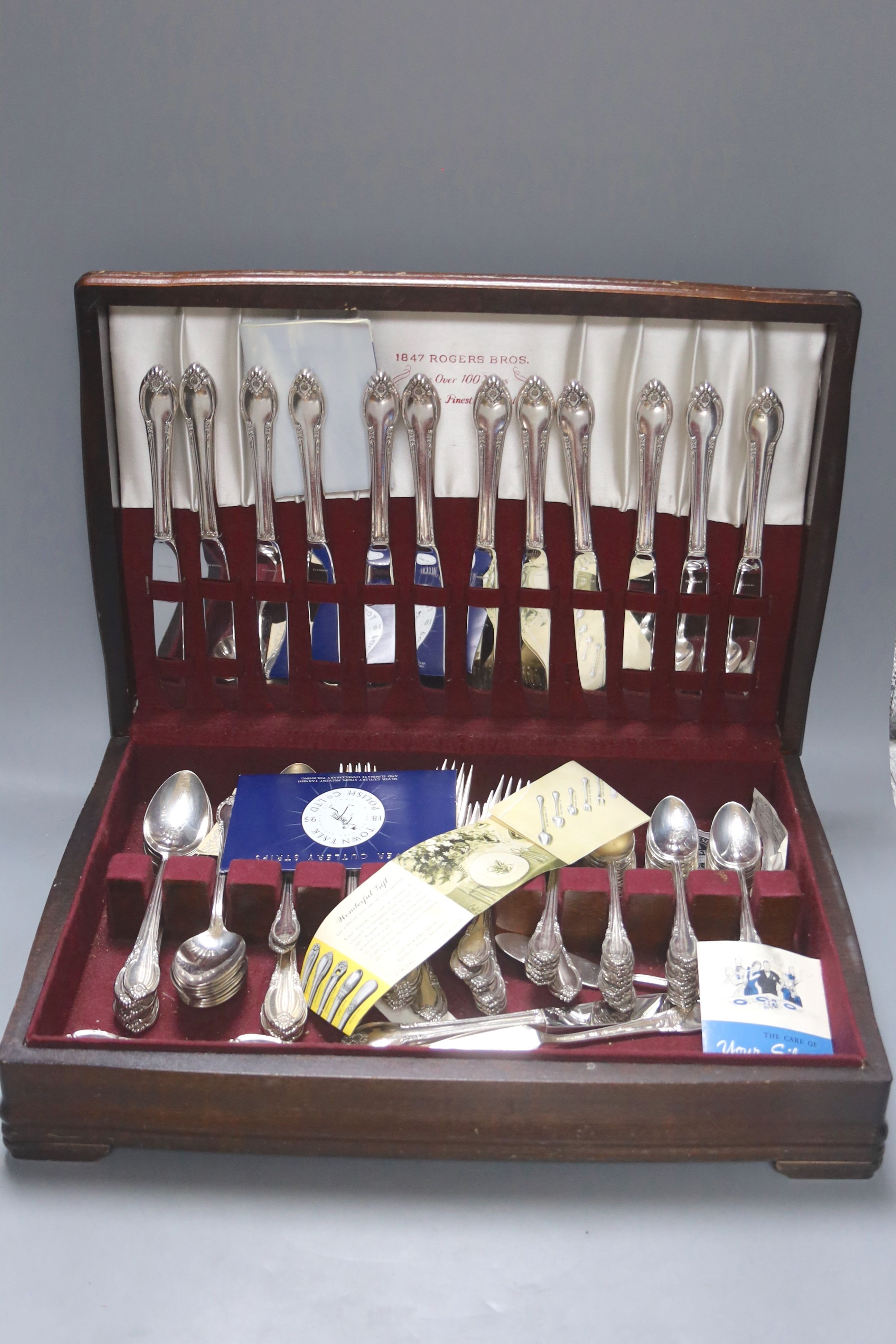 A service of Rogers Bros plated flatware in mahogany canteen and another canteen of plated flatware (2)